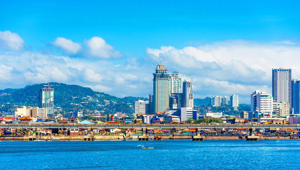 Daytime view of the Cebu City waterfront and tall high-rise buildings, representing the many convenient central locations for where to stay in Cebu.