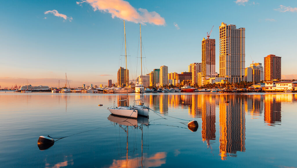 Stunning skyline view of Manila overlooking Manila Bay at dusk, showcasing the vibrant destination.
