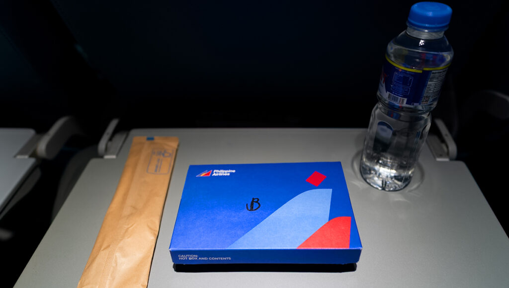 Single packaged meal with a drink, representing Philippine Airlines food.