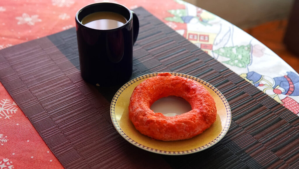 A cup of coffee with sweet bread breakfast, reminiscent of morning fare at the best restaurants in Manila.