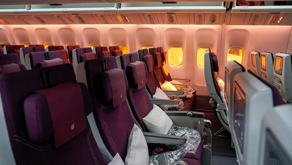 Interior cabin of Qatar Airways flight showing seating and comfort, representing the experience on one of the top choices for the best airline to fly to Philippines from UK.
