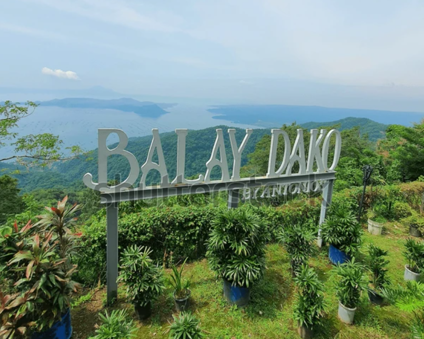 Balay Dako by Antonio's sign with beautiful scenery of Taal Lake and Volcano.
