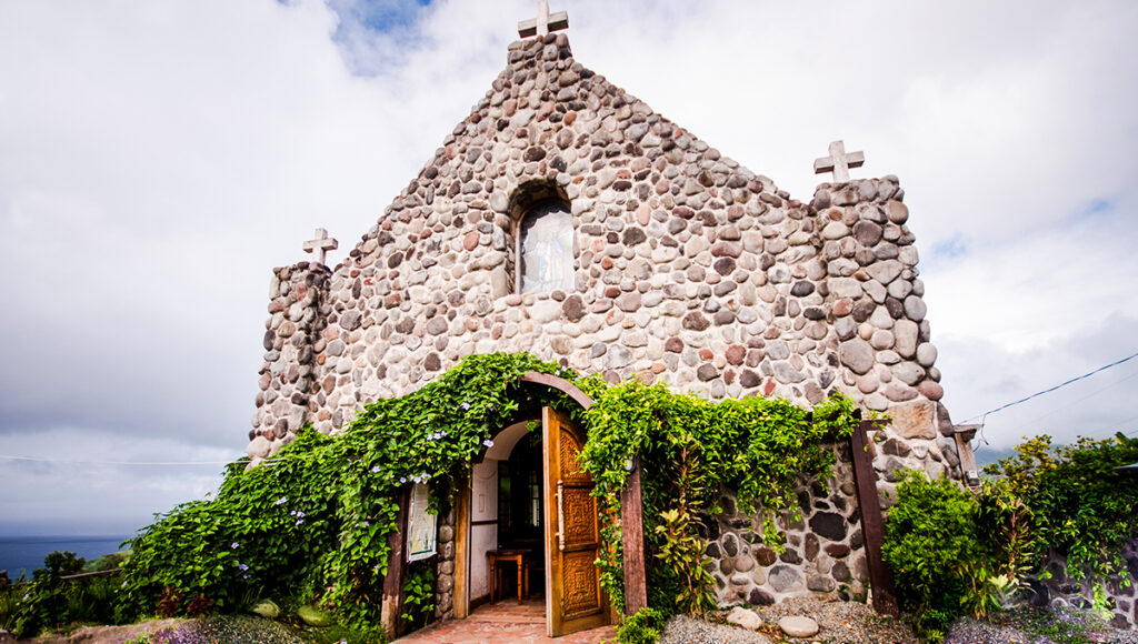 This peaceful Batanes tourist attraction features Tukon Chapel in Basco, built with stone architecture inspired by Ivatan homes. The chapel sits on a hill overlooking the ocean, with wide views of both the sea and countryside, making it a quiet place for reflection and one of the most scenic landmarks in Batanes.