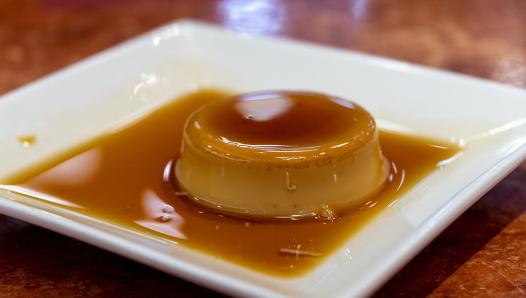 Creamy Filipino desserts leche flan topped with golden caramel sauce.