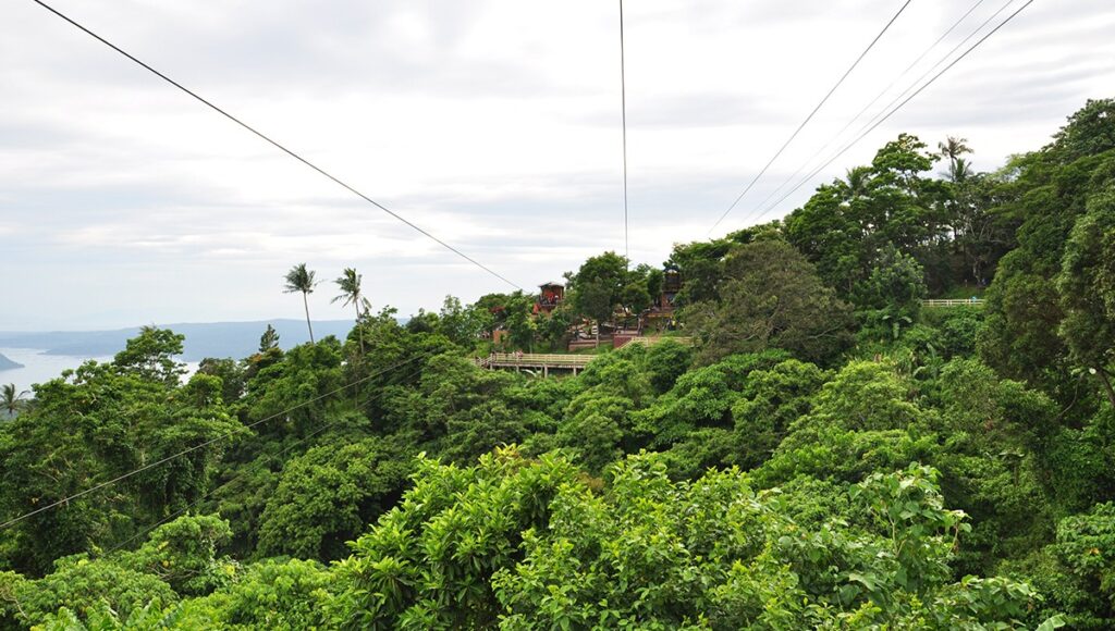 A thrilling zipline over lush green forests, a popular choice for adventure-seekers looking for things to do in Tagaytay