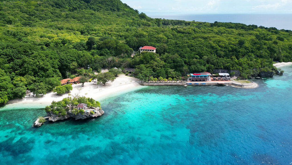 Aerial landscape of Salagdoong Beach, highlighting cliff jumping and swimming as popular things to do in Siquijor.