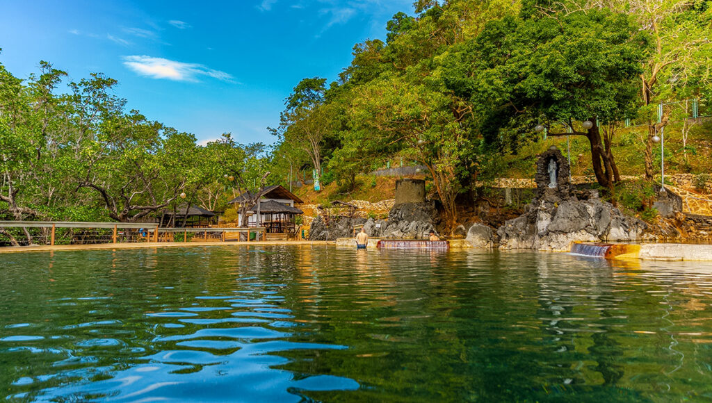 Maquinit Hot Springs in Coron during sunset — one of the most relaxing things to do in Coron, featuring warm saltwater pools and views of surrounding mangroves.