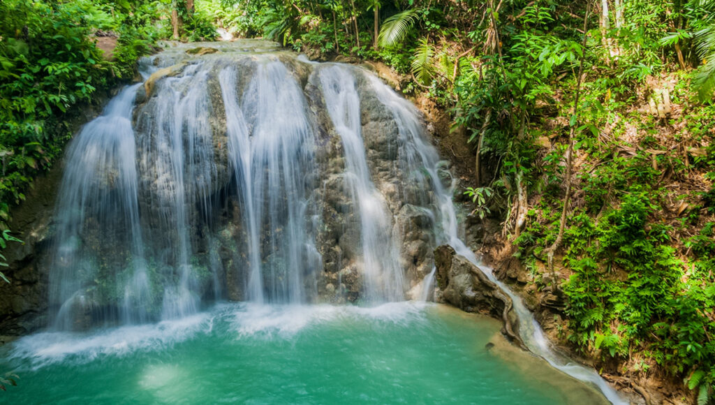 Close-up of a hidden jungle waterfall, showcasing the natural beauty and adventurous things to do in Siquijor.