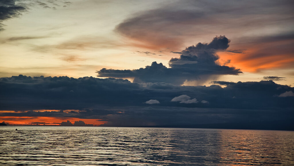 A dramatic sunset over the ocean at Paliton Beach, one of the most relaxing things to do in Siquijor at the end of the day.