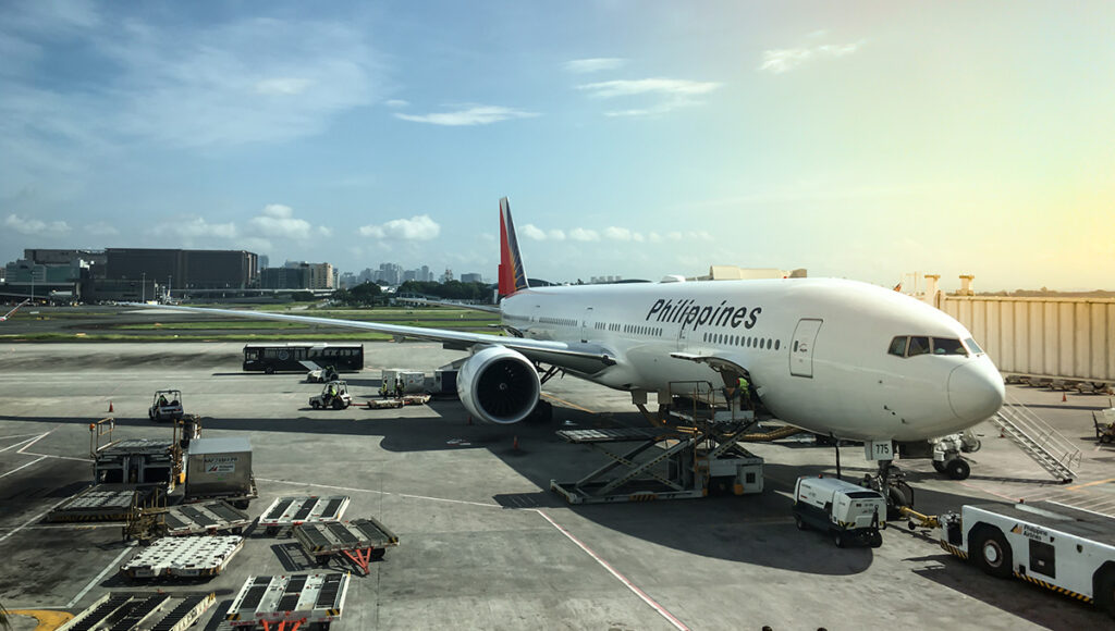 A Philippine Airlines aircraft at NAIA airport in Manila, reflecting the hot and dry conditions characteristic of the Philippines weather in March.