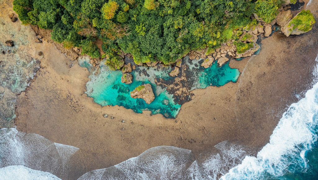 Bird’s-eye view of the Magpupungko Rock Pools in Siargao, with emerald waters perfectly visible during the low tide and stable Philippines weather in March.