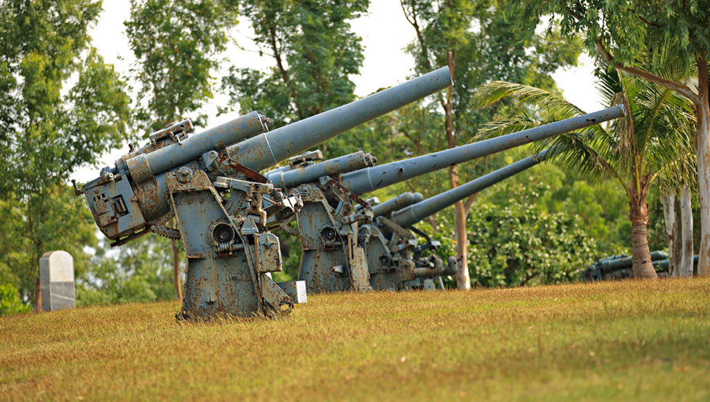 Historic WWII artillery cannons overlooking the coast on Corregidor Island, a significant historical destination for educational day trips from Manila.