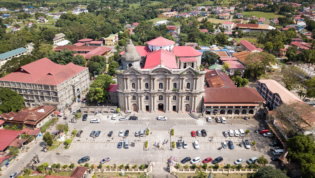 An aerial view of the massive Taal Basilica in Batangas, the largest church in Asia and a key stop on religious or architectural day trips from Manila.