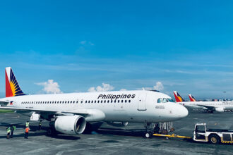 View of several commercial aircraft parked at Manila Ninoy Aquino International Airport, reflecting the busy hub many passengers fly into when booking the cheapest flight to the Philippines.