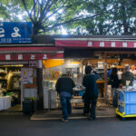 Atmospheric izakaya dining scene, evoking the vibrant evening vibe you’d experience at the best restaurants in Manila.