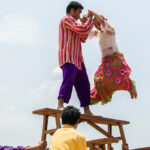 Filipino traditional dance called Sayaw sa Bangko, showing skilled dancers balancing gracefully on narrow wooden benches while performing precise footwork that highlights agility, rhythm, and Filipino folk culture.