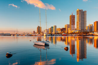 Stunning skyline view of Manila overlooking Manila Bay at dusk, showcasing the vibrant destination.
