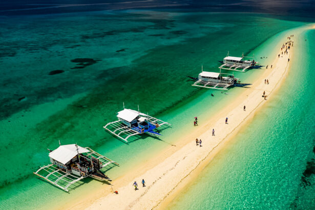 Undiscovered beaches in the Philippines featuring Kalanggaman Island in Leyte with its long white sandbar and crystal-clear blue sea