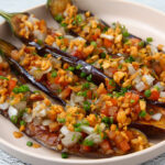 Is Philippines good for vegetarians? Traditional Filipino Ensaladang Talong made with grilled eggplant, tomatoes, and onions.
