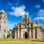 Front view of St. Augustine Church in Paoay, a UNESCO World Heritage site and one of the most iconic historical places in the Philippines, featuring massive coral stone walls and intricate Baroque architecture.