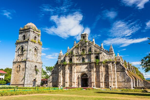 Front view of St. Augustine Church in Paoay, a UNESCO World Heritage site and one of the most iconic historical places in the Philippines, featuring massive coral stone walls and intricate Baroque architecture.