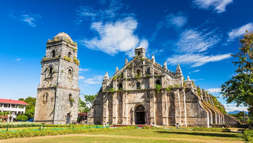Front view of St. Augustine Church in Paoay, a UNESCO World Heritage site and one of the most iconic historical places in the Philippines, featuring massive coral stone walls and intricate Baroque architecture.