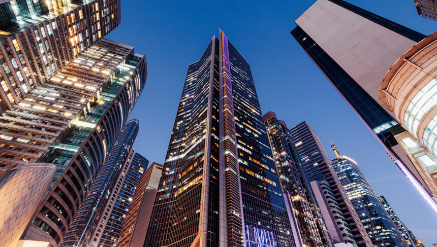Urban city skyline in the Philippines featuring modern architecture and lit windows at night, illustrating how long to spend in the Philippines when visiting metropolitan hubs like Manila.