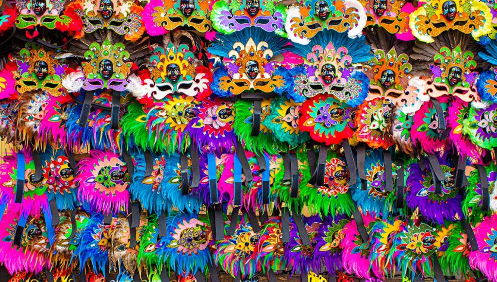 Hand painted Ati-Atihan masks on display at Papierus Arts and Crafts, showcasing creative things to do in Kalibo for art lovers and collectors.