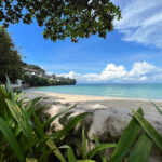 Pristine white sand and crystal-clear waters of a Zamboanga beach, showcasing why coastal destinations rank among the top places to visit in Zamboanga for nature lovers.