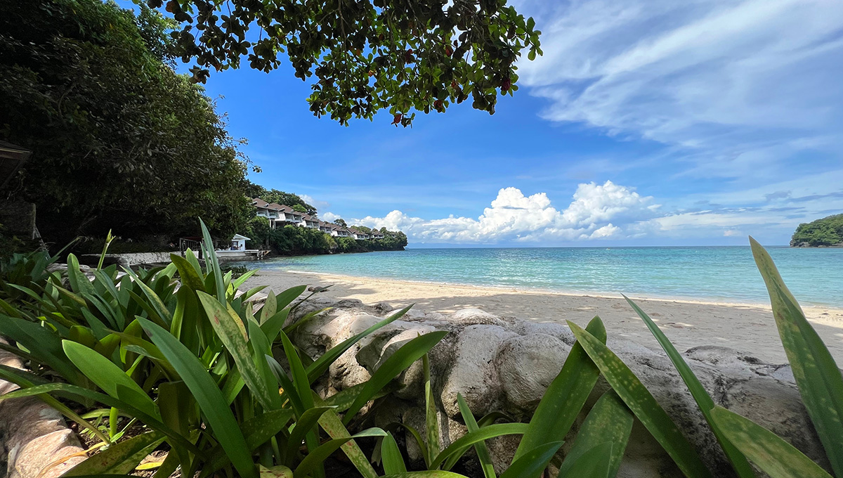 Pristine white sand and crystal-clear waters of a Zamboanga beach, showcasing why coastal destinations rank among the top places to visit in Zamboanga for nature lovers.