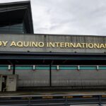 The exterior facade of Ninoy Aquino International Airport (NAIA) in Terminal 3, serving as the main gateway for travelers looking for a Manila airport lounge.