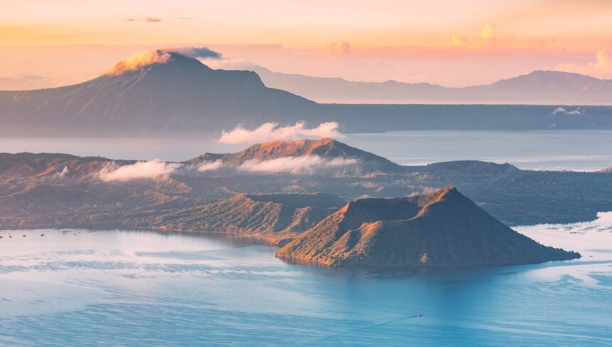A stunning sunset view of Taal Volcano and Lake, one of the most iconic things to do in Tagaytay.