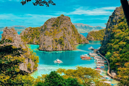 An aerial view of the turquoise waters at Kayangan Lake, Palawan, highlighting the clear visibility often enjoyed during the hot Philippines weather May.