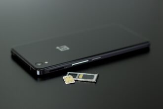 Black smartphone with a SIM card and memory card for Philippines SIM Card use