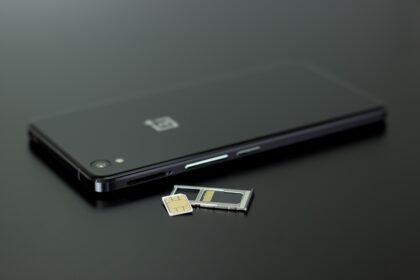 Black smartphone with a SIM card and memory card for Philippines SIM Card use