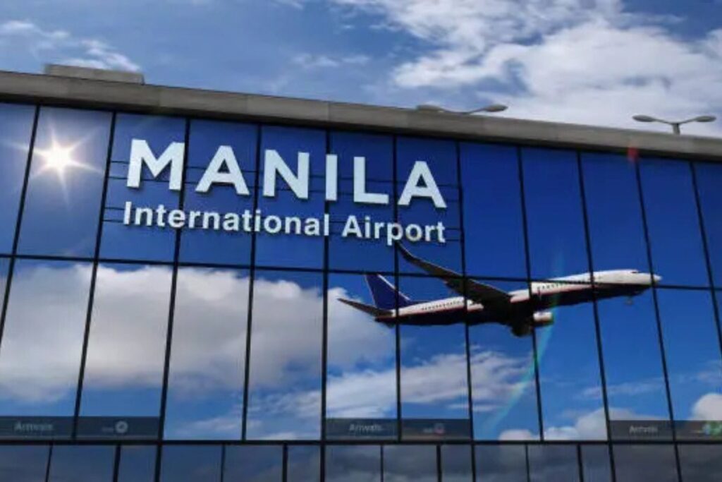 Airplane landing at Manila airport reflected in the terminal glass, highlighting Philippines Airports for travellers