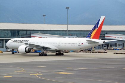 Philippine Airlines aircraft at an airport runway, highlighting key Philippines Airports for travellers