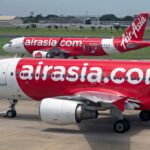 AirAsia Philippines Baggage Allowance guide featuring AirAsia aircraft on an airport runway