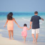 Family enjoying a sunny beach together during a relaxing Philippines family holiday