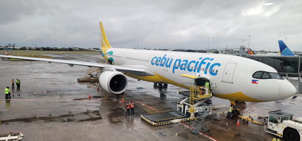 Cebu Pacific vs Philippine Airlines: Cebu Pacific aircraft parked at an airport terminal
