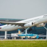 Philippine Airlines Airbus A330 taking off, highlighting air travel for Domestic Flights in the Philippines