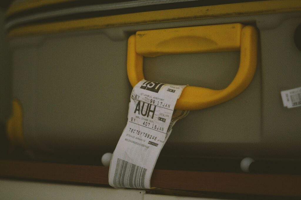 Yellow suitcase handle with a barcode tag illustrating Cebu Pacific Baggage Allowance