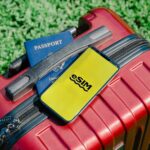 Philippines eSIM with a smartphone, suitcase and passport for travel