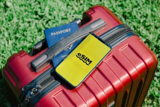 Philippines eSIM with a smartphone, suitcase and passport for travel