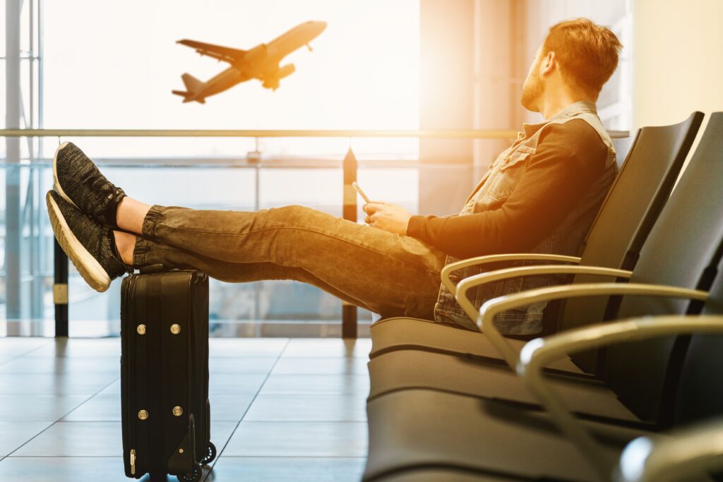 A man waiting at the airport for Domestic Flights in the Philippines