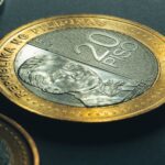 Gold and silver coins representing Philippines Currency and money exchange for travellers