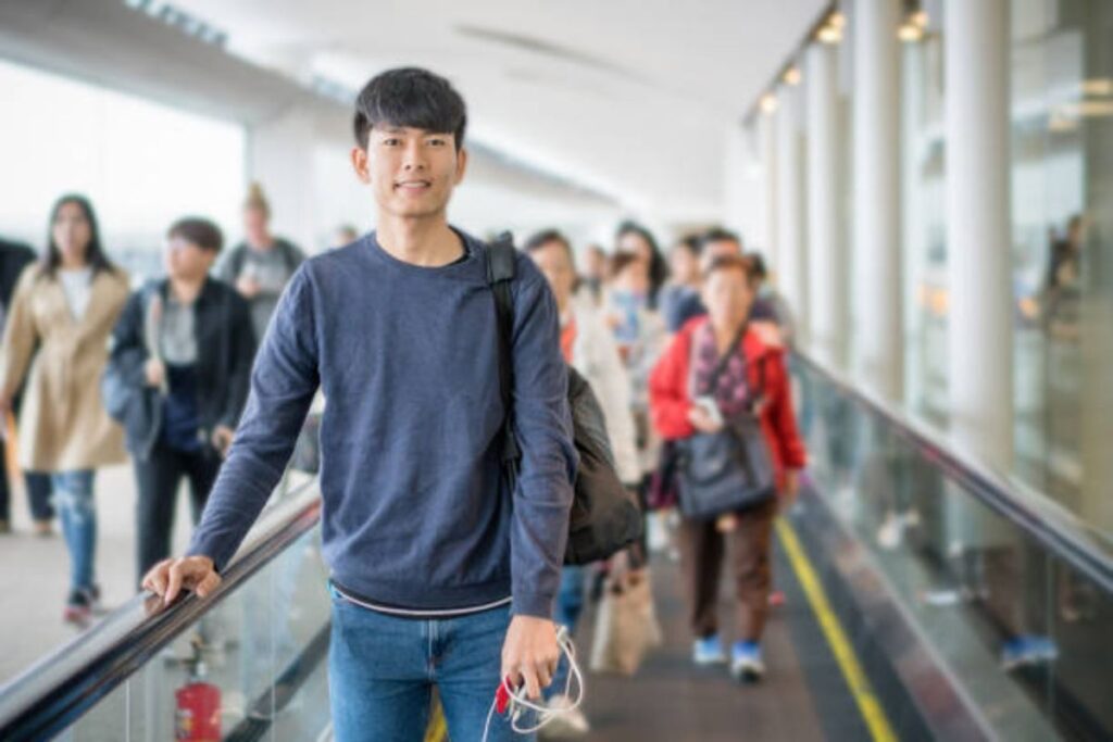 Young Asian traveller waiting for a flight, illustrating travel planning and Philippines Airports